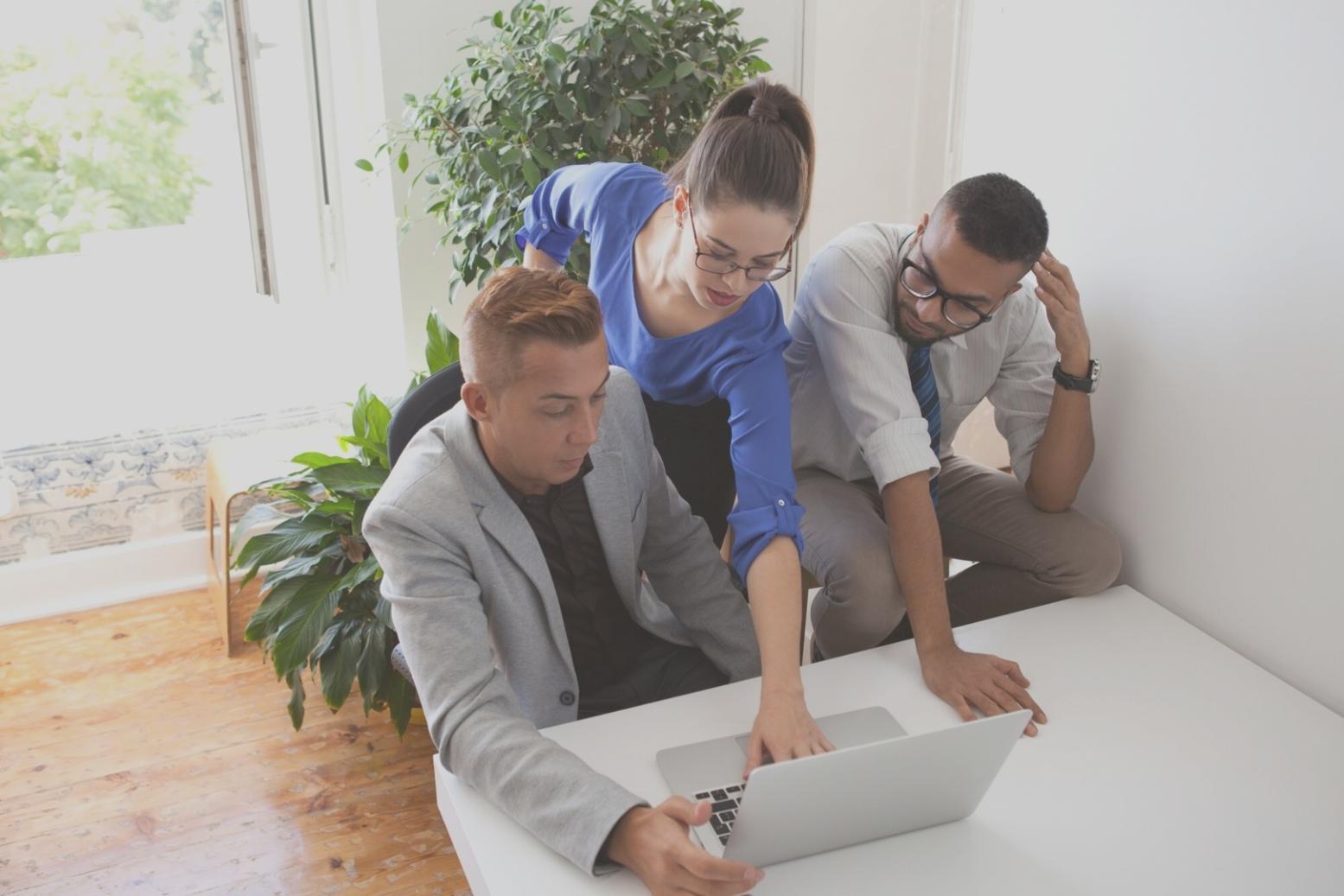 Professional trading environment with multiple screens displaying market data and analytics